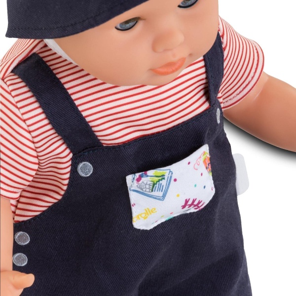 Augustin Little Artist is a 14-inch, soft-bodied baby doll for little ones wanting a baby of their own to love Augustin Little Artist is dressed in overalls with a colorful chest pocket and wears a color-coordinated hat and removable shoes Augustin's face, arms and legs are made of soft-to-the-touch vinyl Features signature Corolle vanilla-scented vinyl Designed and styled in France From 2yo 4062013130330