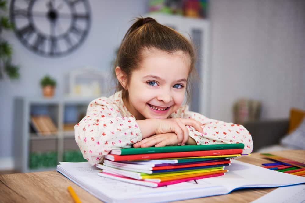 smiling girl studying home
