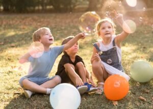 full shot kids playing outdoors